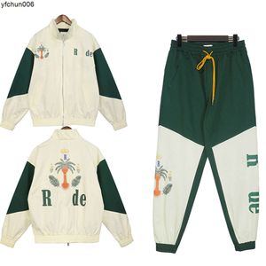 Rhude MensトラックスーツY2Kスポーツスーツデザイナージャケットパンツステッチカラーペアレディースストリートカジュアルファッション333 {カテゴリ}