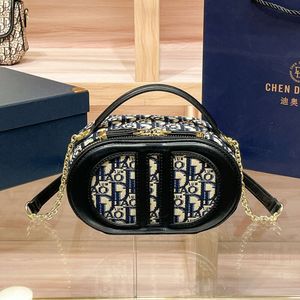 2024 NOWOŚĆ D Family Blue Jacquard Canvas Expossed Logo Oval Camera Premium pojedyncze ramię Crossbody Bag 75% Hurtowa fabryka