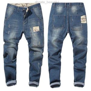 Męskie dżinsy męskie 2021 Kamuflażowe zszycia sprężyste spodnie męskie spodnie marki Czarny niebieski plus rozmiar 42 44 46 48 Large