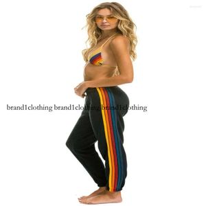 Calças femininas moda europa-eua estilo sweatpants mulheres cintura elástica arco-íris listrado magro pequeno pé esporte