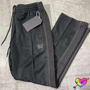 Pantaloni da uomo Simile Tutti i pantaloni con aghi neri Uomo Donna 1 1 Pantaloni da pista con aghi a farfalla ricamati di alta qualità Pantaloni dritti AWGE 230321 541