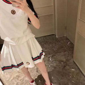 Italian fashion designer classic letters luxury metal label round neck women's T-shirt + Luxury pleated skirt Fashion casual vacation women spring summer set