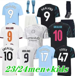 23 24 Haaland Mans Futbol Formalarının Şehirleri Blue City de Bruyne Phillips Grealish Ferran Mahrez Foden Bernardo Joao Cangelo Z Rodrigo Futbol Gömlek Erkek Çocuk Kiti Çocuk Kiti