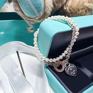 Pendanthalsband Fashion Luxury Designer Halsband Hjärta återvänder till hängsmycken Form Double-Deck-kedjor med pärlhalsband Party Rose Gold Platinum L240311