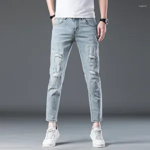 Jeans da uomo strappati per uomo Pantaloni skinny alla caviglia hip-hop effetto consumato Abbigliamento patchwork con pittura elasticizzata blu chiaro
