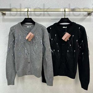 Kvinnors stickor tees designer tidigt vår ny nanyou miu elegant och smal rund nackfjäder paljett vatten diamant dekoration stickad cardigan hdjq