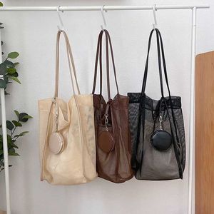 HBP Versione coreana senza marchio della nuova borsa da spiaggia da donna per il tempo libero, moda, tendenza, pacchetto a spalla singola, tote creativa in tela a rete