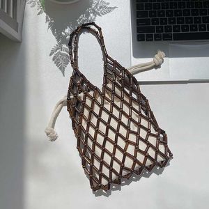HBP Non-Brand 2024 New Summer Korean Beaded Carried Handbag Small Fashion Mesh Straw Beads Beach Bag Hand Hollow-Out Woven Women Tote