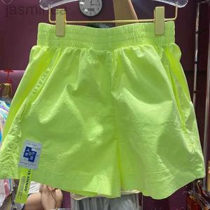 Pantaloncini da donna Pantaloncini estivi color caramello A vita alta A-line Gamba larga Etichettatura Pantaloni corti Giallo Coreano Casual Street Wear ldd240312