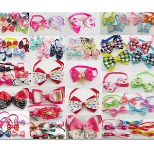 100PCS LOT Big Fashion Dog Apparel Pet Puppy Cat Cute Tow Taps Nectes Bowknot Pies Pielęgnacja Produkty mieszane LY03278D