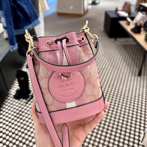 Designerpåsar är 90% rabatt på billigare 2024 Spring New Womens Bag Dempsey Bucket Water Doft Bud Canvas One Shoulder Crossbody