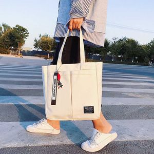 Canvas-Tasche für Damen, japanische und koreanische Instagram, große Kapazität, College-Studenten-Klasse, Tragetasche, Handheld-Umhängetasche 240315