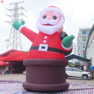 Attività all'aperto Babbo Natale gonfiabile gigante da 33 piedi sul modello pubblicitario natalizio del camino con luce a led per la decorazione del cortile