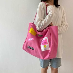 Japão e Coreia do Sul Bolsa de ombro de lona de grande capacidade para mulheres Popular Instagram Style Patch Underarm Tote Bag 240315