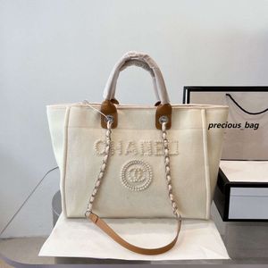 2024 Designer-Tasche Sommer Strand C-Buchstabe Umhängetasche Flash-Bürotasche Klassische Damen-Leinentasche mit Knopf Retro-Luxustasche