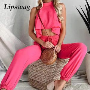 Summer High Street Solid Twopiece Set Sexig ihålig midja Slimfit Versaile Women Halter ärmlösa Lotus Leaf Top Pants 240326