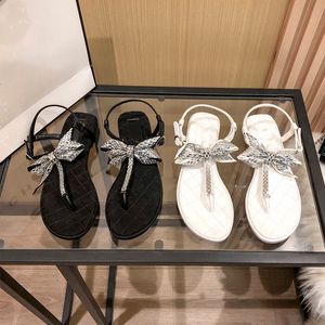 Luxuriöse Damen-Sandalen, flache Flip-Flops mit niedrigem Absatz, große Schleife mit Bohroberteil, verschönernde Strandschuhe, Urlaubssandalen