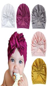 Cappello per neonato in tinta unita Cappello per bambino Ragazza in cotone Morbido fiocco grande Turbante Berretti per cofano Solidi Baby Shower Puntelli192Q3170438