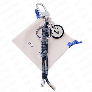 The style of the leather rope keychain is fashionable and playful The Damier canvas round logo looks exquisite and is decorated with rope knots and ribbon trims