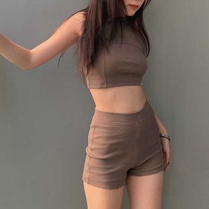 Sports and leisure style spicy girl set with split splicing exposed navel slim fit small tank top high waist solid color shorts