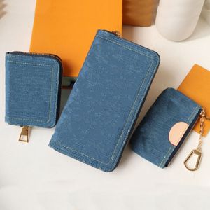 Ny 2024 Key Pouch Luxury Designer Denim Blue äkta läder Gyllene hårdvaruplånbok Kvinnor Fashion Cotton Foder Zip Stängning Koppling Handväska Purse