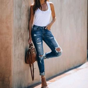 Jeans slim a vita alta traforati elastici a vita alta con piedi piccoli