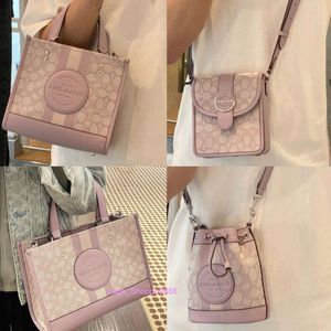 Fabrik grossist 2024 Ny kvinnors väska Dempsey Tote juli Taro Purple Series Field 22 One Shoulder Messenger Underarm