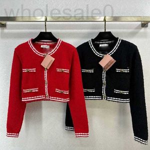 Kadın Sweaters Designer 2024 Erken Bahar Yeni Nanyou Miu Kızların Tarzı Azaltılmış Yaş Gevşek Mektup JACQUARD KISA KUKULU KUTUCU KURUMU TDIE