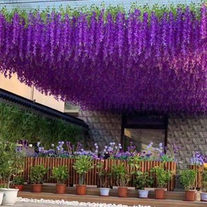 装飾的な花12pcs wisteria人工弦パーティーパープルピンクの白いラタン偽植物ぶらぶら吊り下げガーランドホームウェディング装飾