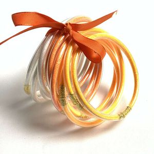 12 lager band blandad färgläkningsserie glänsande guldrosa söt båge kvinnors armband jelly armband