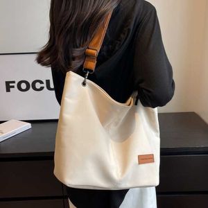 Bolsa de ombro de lona minimalista japonesa e coreana feminina com grande capacidade diagonal cruz sacola pode ser impressa 240315