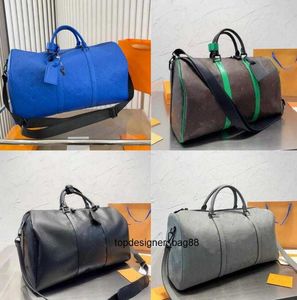 Bolsa de grife de grife masculino Moman bolsas de luxo malas de bagagens de couro de alta qualidade bolsa de compras bolsa bolsa bolsa de alta capacidade de viagem ao ar livre bolsa de ombro