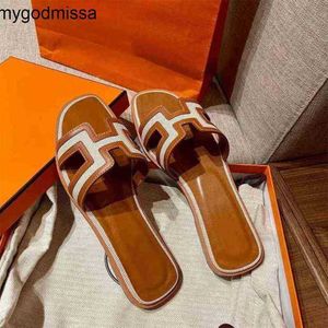 Orans tofflor kvinnors sandaler panda färg matchar platt botten sommar ny fritid fårskinn retro cool sanya resort strand slitage