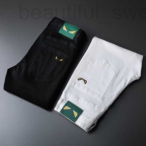 メンズジーンズのデザイナー香港ハイエンド春/夏の新しい黒と白の刺繍モンスター弾性スリムフィットスモールフィートパンツトレンディブランドR5VQ