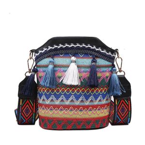 Fashion womens bag 2024 new super popular ethnic style personalized single shoulder crossbody bag tassel bucket bag woven womens bag