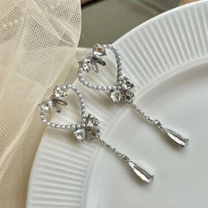 Kolczyki stadnorskie Koreańska wersja Pearl Heart Bow Tassel Kobiet Simple Sier Color Party Biżuteria Piękne prezenty