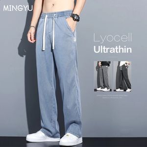 Odzież marki Lato wysokiej jakości Lyocell Fabric Dżinsy Mężczyźni luźne proste, cienkie elastyczne talii Spodnie dżinsowe spodnie M5xl 240305