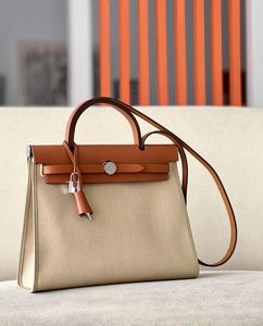 Guangzhou High quality Fashion handbag Canvas Bag Women's portable cowhide shoulder women's large designer handbag