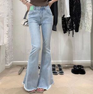 Women's light blue frosted edge flared pants with low waisted slim fit and floor dragging elastic jeans