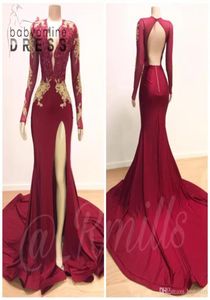 Abiti da ballo a sirena a maniche lunghe rosso bordeaux Plus Size Applicazioni in pizzo dorato Spacco alto Ragazze arabe africane Festa serale formale 7837656