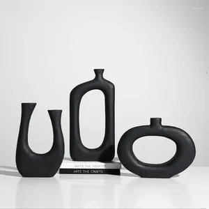Декоративные статуэтки Современные черные абстрактные геометрические геометрические вазы из массива дерева Экзотические цветочные украшения цветочной композиции Обеденный стол в продаже