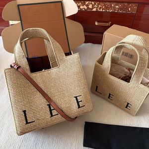 Bolsa de designer de luxo feminino Tote bordado compras grama de grama tecido vegetal estilo francês ombro crossbody praia