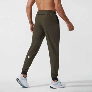 2024 lululemeni calças masculinas yoga outfit esporte secagem rápida cordão ginásio bolsos sweatpants calças casuais dos homens cintura elástica giu668