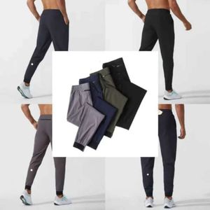 2024 lululemeni calças masculinas yoga outfit esporte secagem rápida cordão ginásio bolsos sweatpants calças casuais dos homens cintura elástica guk886