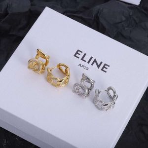 Triumphal Arch Twisted Diamond med Sier Needle Brass Material örhängen och eleganta örhängen för kvinnor