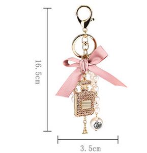 Ny modeimitation Pearl Parfym Bottle Keychain Car Key Ring Women Bag Charm Accessories Söt Bow Key Chain Creative Keyrings