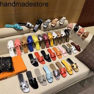 Luxury Slipper Orans tofflor för kvinnliga ytterkläder 2024 Ins Trend Summer Sheepskin Shoes Sandaler och Fashion Beach Flat Bottoms