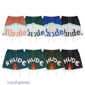 Shorts masculinos designer marca verão novo rhude contrastante cor retalhos carta impressão cordão high street solto secagem rápida esportes calças casuais