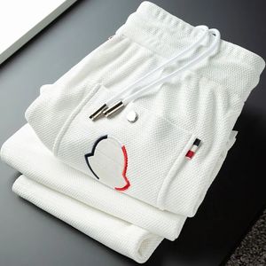 2024 Mens Calças Designer Moda Roupas Mulheres Calça Outono Inverno Casual Homens Calças Esportivas Cordão Corredores Sweatpants Streetwear Tamanho Asiático M-5XL