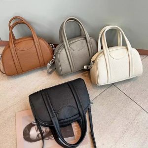 Elegant women's bag bowling bag small crowd bag first layer cowhide bag Mantou bag senior portable cross body shoulder bag women